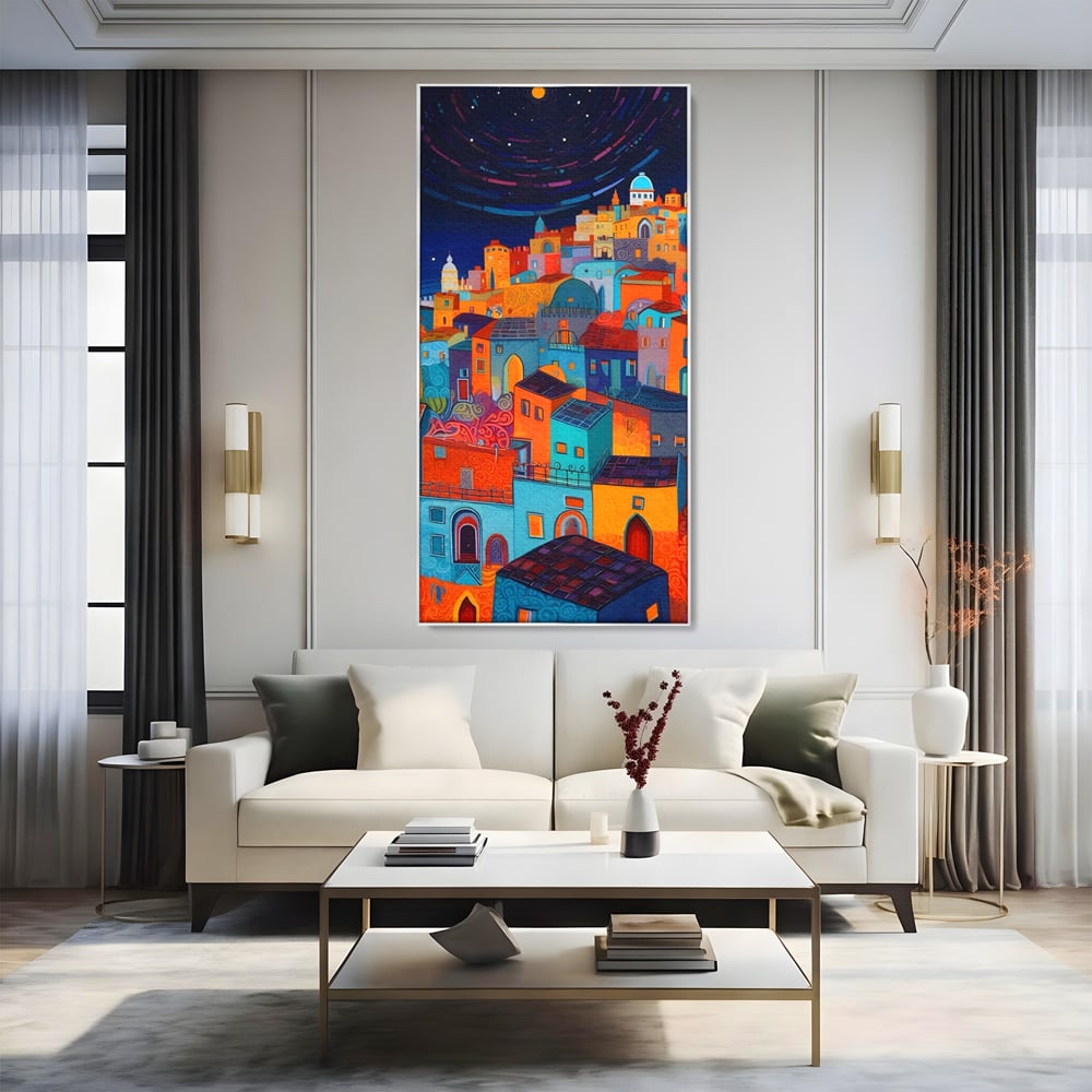 Tablou canvas cu tablou canvas cu oras colorat si cer instelat, in rama de aluminiu argintiu, pe perete intr-un living